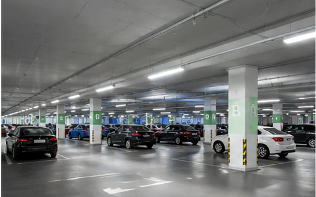 Parking structure with overhead lighting and power distribution