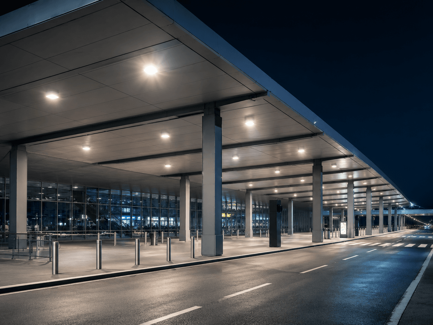 Airport transport facility illuminated by outdoor street lighting