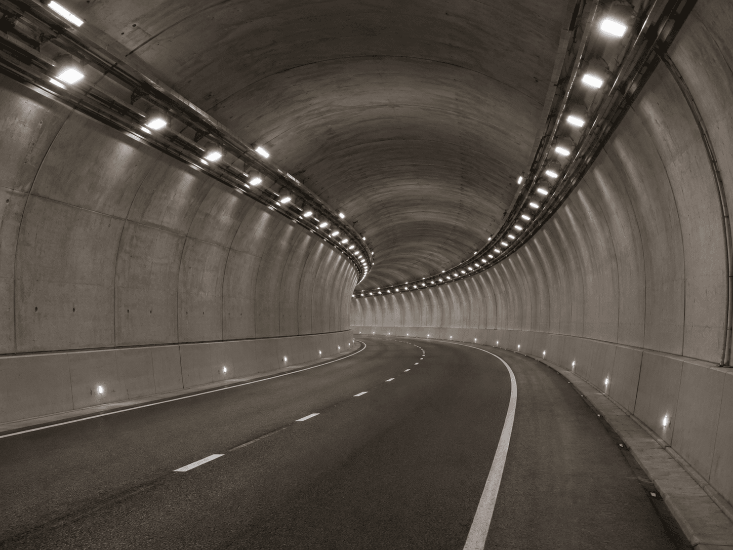 Tunnel interior illuminated by heavy-duty LED tunnel lighting
