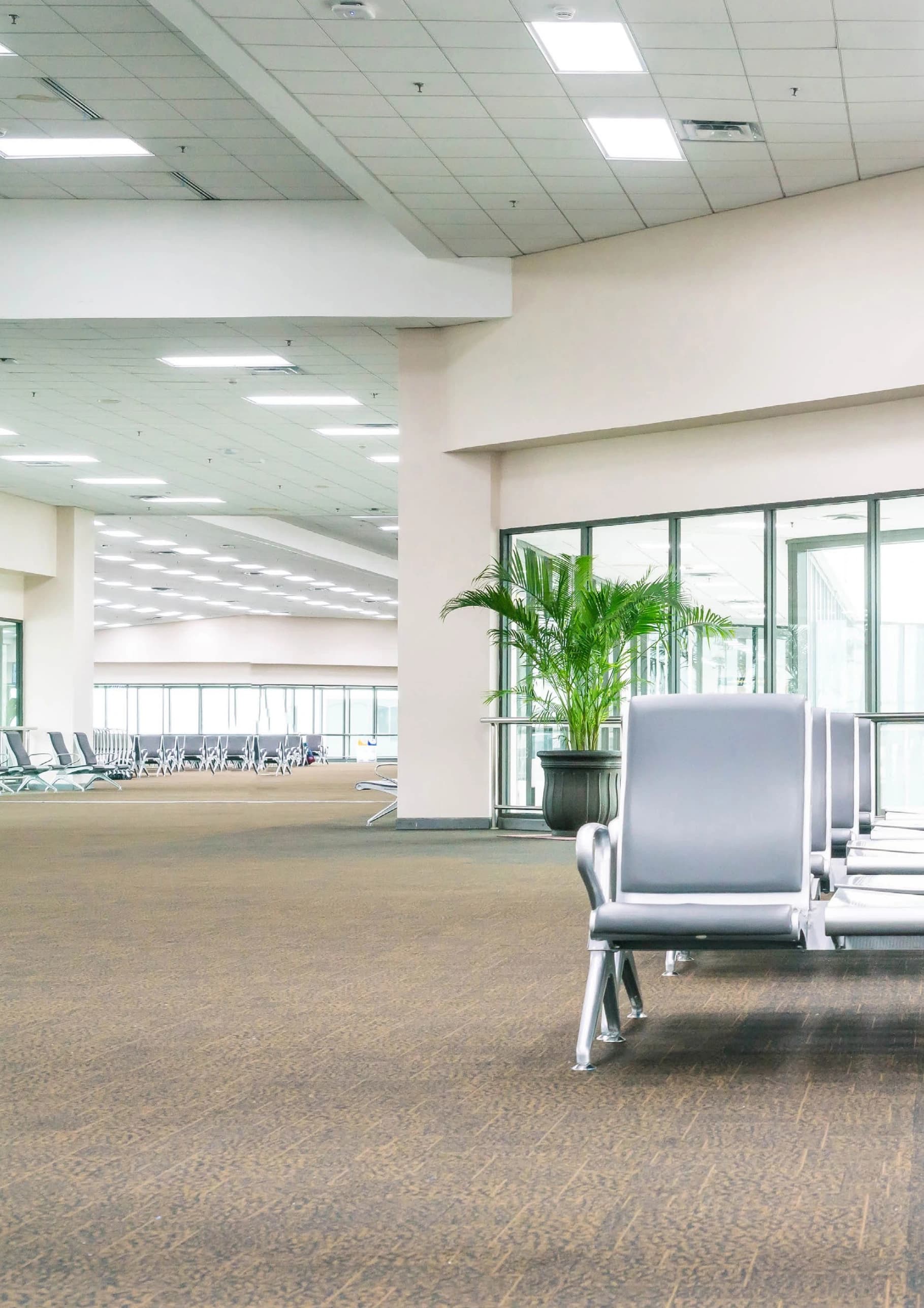 Airport waiting area illuminated by recessed DPNL panels
