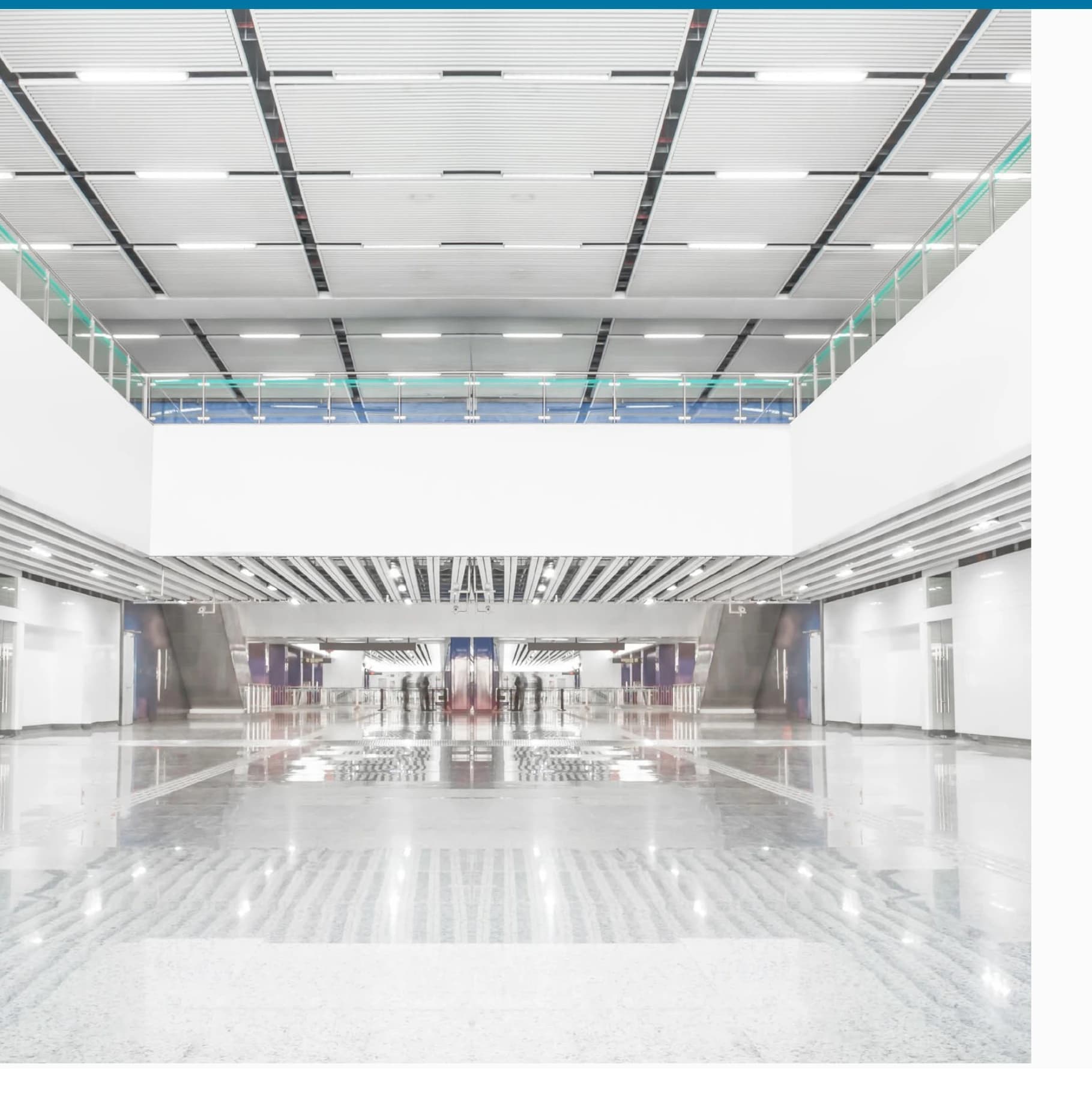Modern public interior illuminated by integrated panel lighting