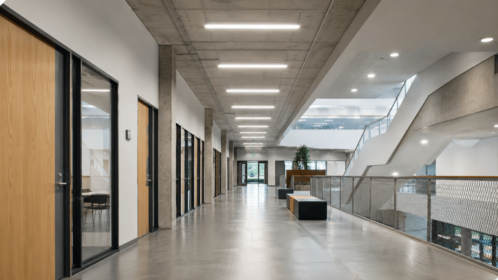 Education corridor illuminated by linear LED lighting
